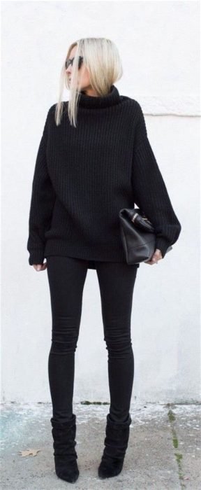 Menina vestindo uma roupa preta para o inverno 