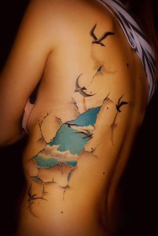 photos-of-tattoos-3d-birds-sky-on-the-back