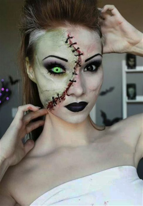 Garota com maquiagem para o halloween como zumbi sem metade do rosto 